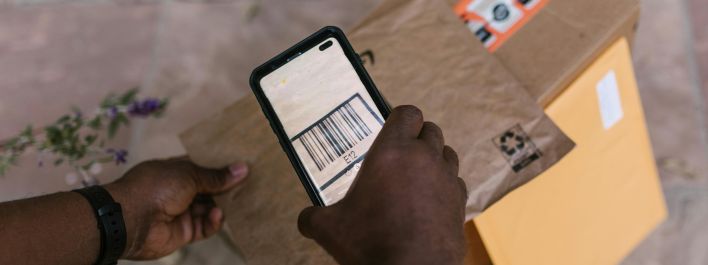 Deliveryman Scanning the Barcode