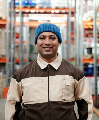 Photo of Man Wearing Blue Beanie Smiling